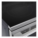 Close-up of LG electric range black glass cooktop showing UltraHeat Power Boil cooking element