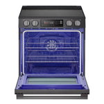 LG induction slide-in range with oven door open, showing blue oven interior, convection fan and multiple racks