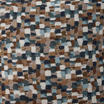 Close-up of Laila accent pillow fabric with textured geometric pattern in blue, brown, beige and white