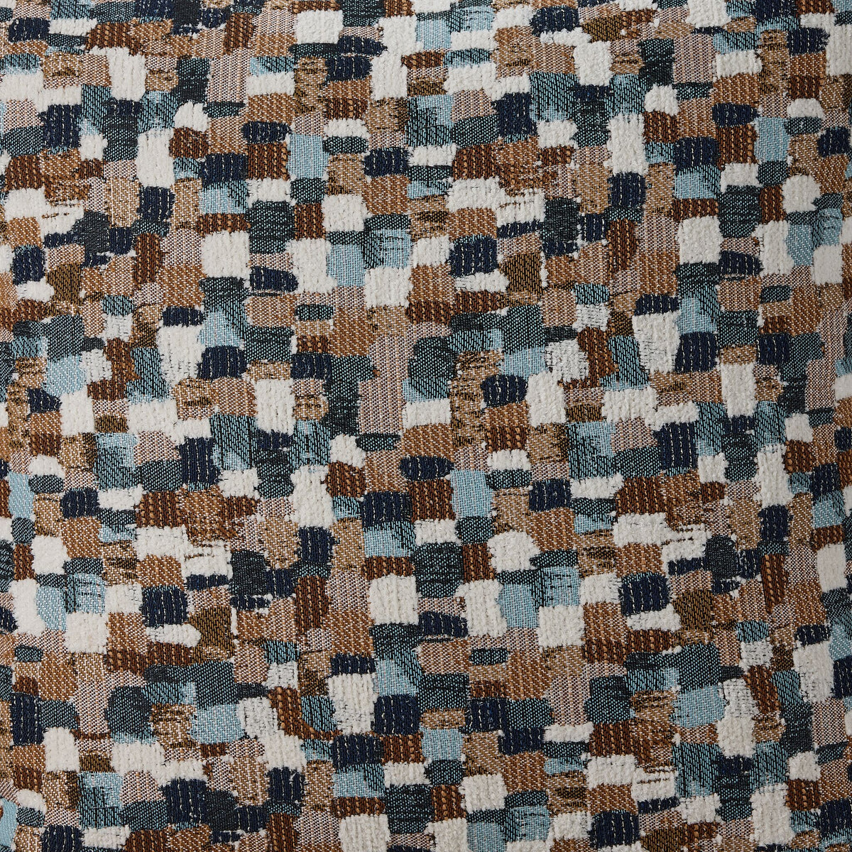 Close-up of Laila accent pillow fabric with textured geometric pattern in blue, brown, beige and white