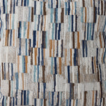 Close-up of Laila accent pillow fabric with abstract stripes in blue, brown, beige and white