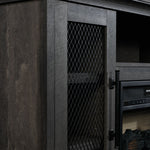 Close-up of Millbrook Fireplace TV Stand showing Fawn Aged Oak finish, black diamond mesh cabinet door and metal handle