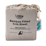 Little Leon’s Bamboo Fitted Crib Sheet in Moonbeam drawstring packaging with 100% bamboo and 250 thread count details