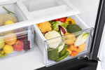 Samsung 33" French door refrigerator interior close-up showing clear crisper drawers filled with fruits and vegetables