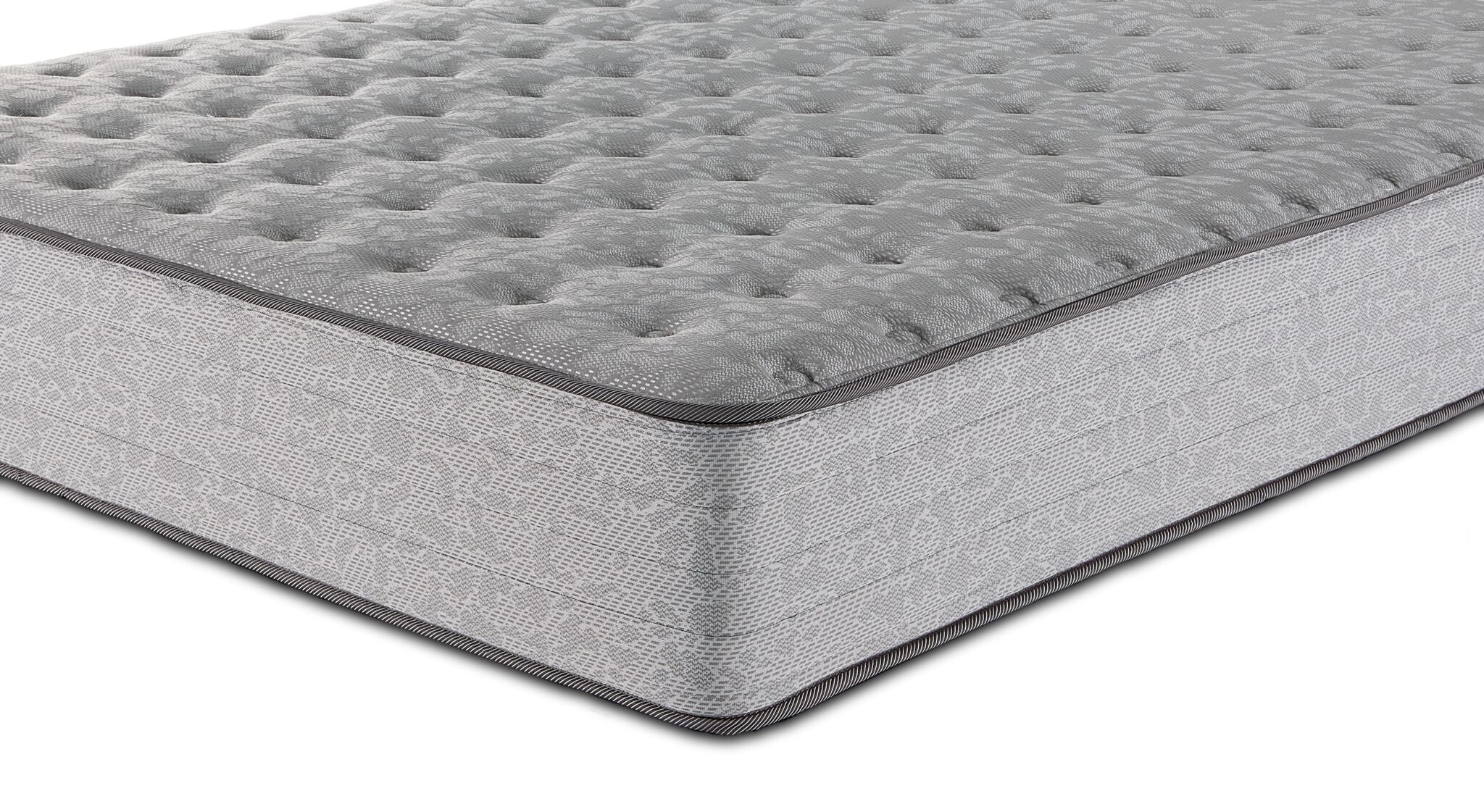 Close-up of Sealy Burchelle Extra Firm Tight Top Twin mattress showing tufted surface, piping and patterned side panel