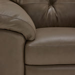 Sloan II close-up showing chocolate leather upholstery, seat cushion and stitching detail