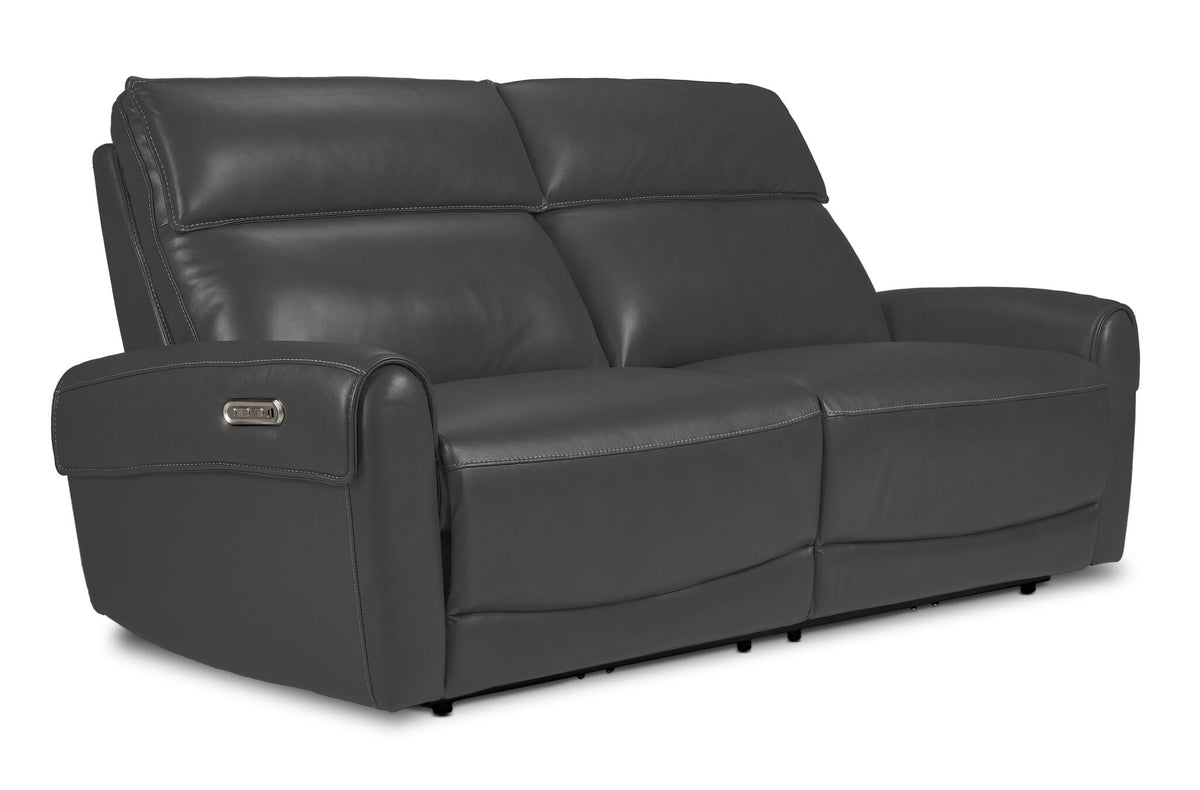 Theo Leather Dual Power Reclining Sofa - Granite shown at an angle with padded headrests, plush seating and curved arms
