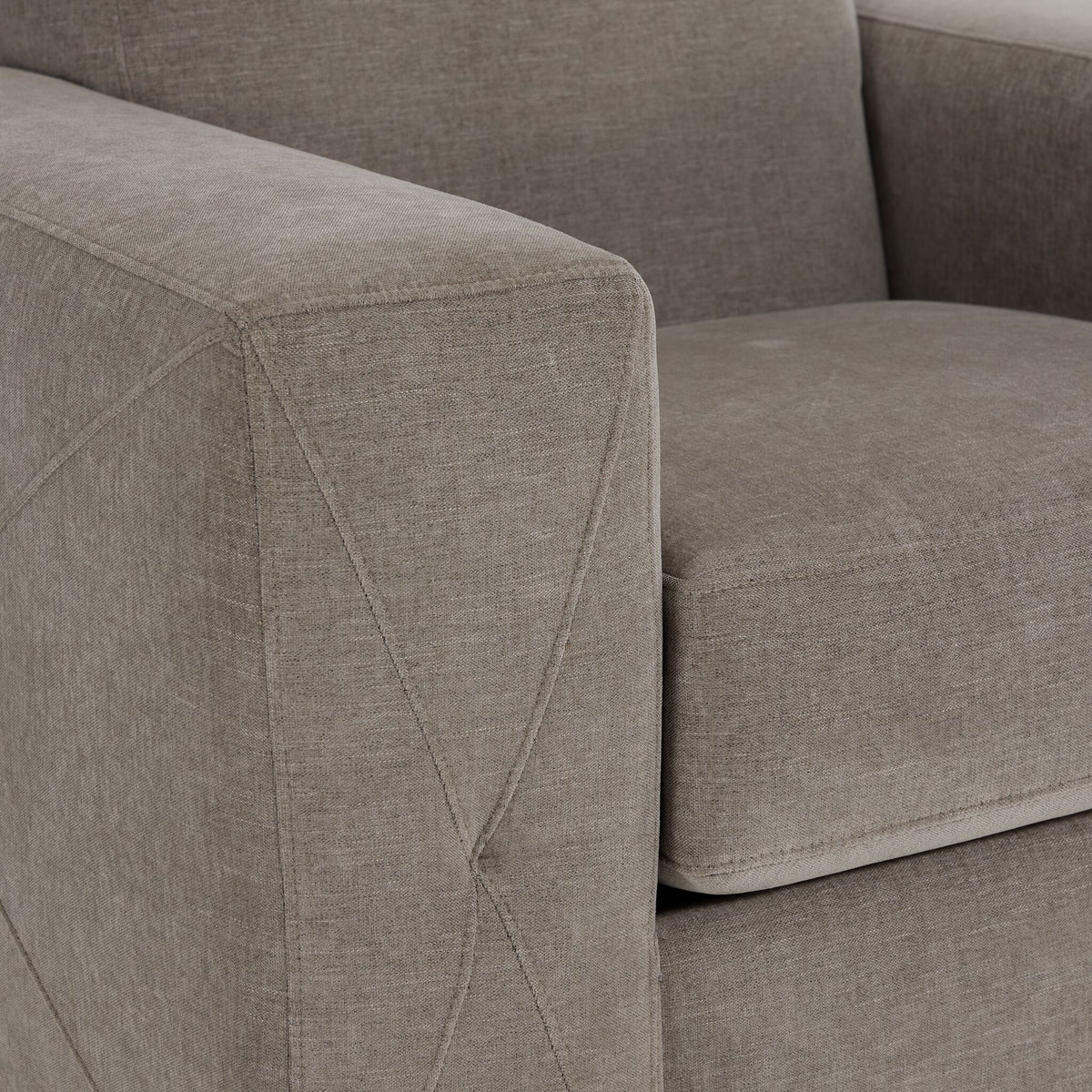 Valetta wheat upholstery close-up showing textured fabric and decorative cross stitching on the wide track arm