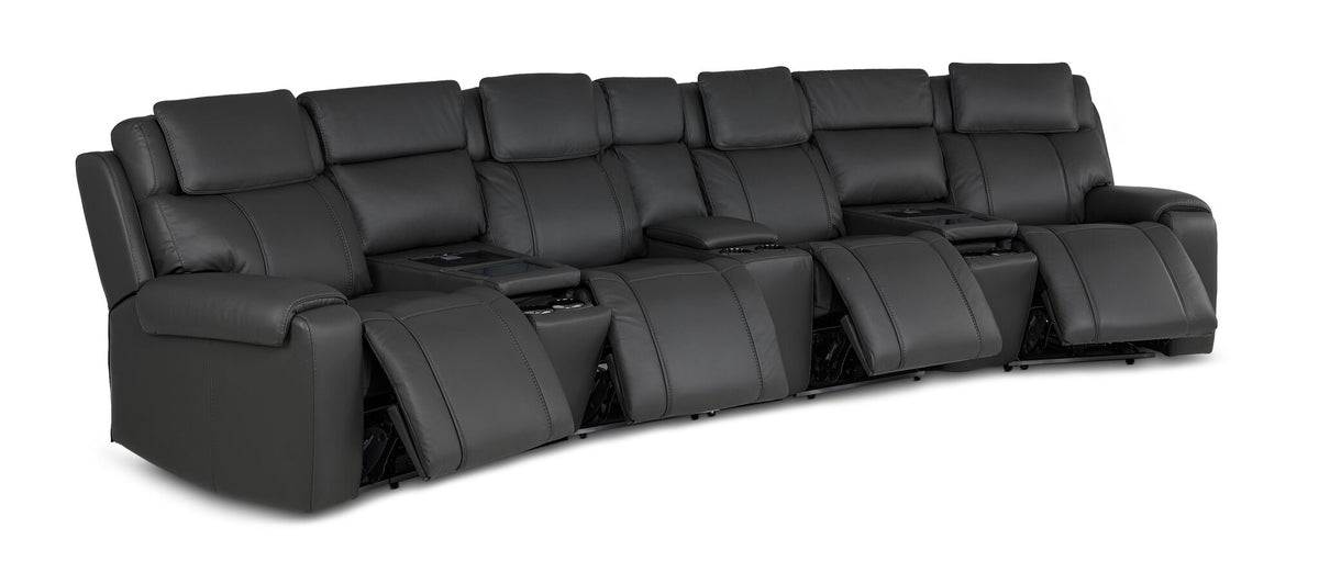 Velocity dark grey home theatre seating angled view with multiple power footrests extended and padded headrests