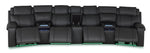 Velocity dark grey home theatre seating front view with footrests extended, open console and accent lighting