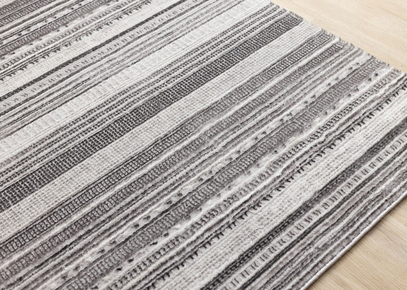 Zola 6'7" x 9'6" Patterned Rows Area Rug - Grey, White, Black