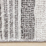 Zola 6'7" x 9'6" Patterned Rows Area Rug - Grey, White, Black