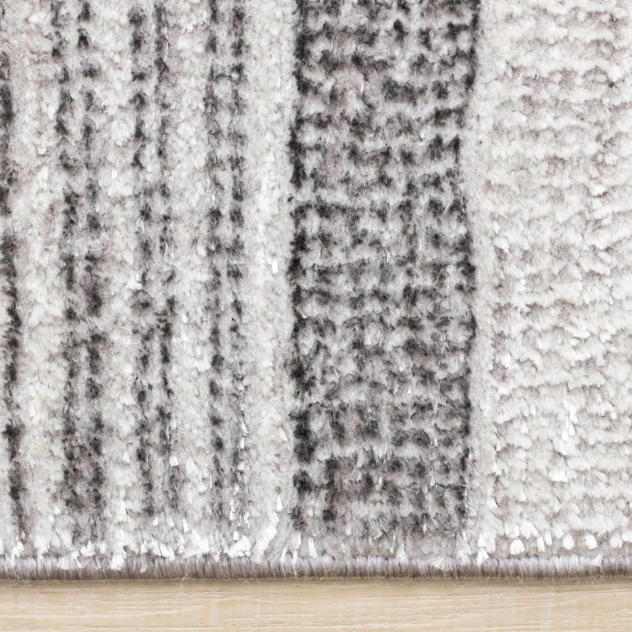 Zola 6'7" x 9'6" Patterned Rows Area Rug - Grey, White, Black