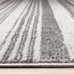 Zola 5'3" x 7'7" Patterned Rows Area Rug - Grey, White, Black