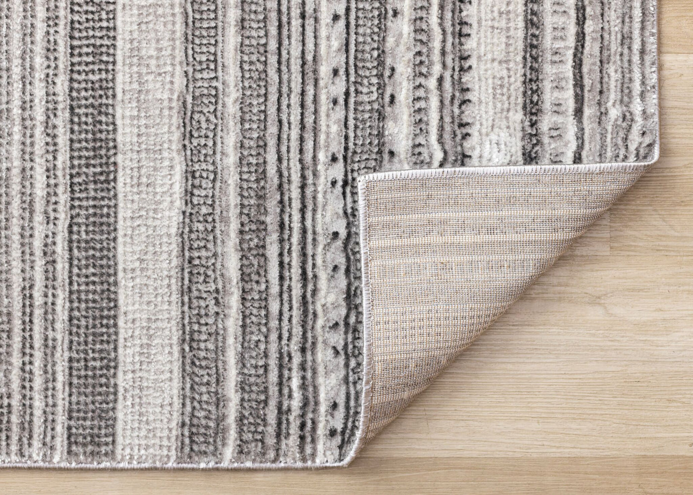 Zola 6'7" x 9'6" Patterned Rows Area Rug - Grey, White, Black