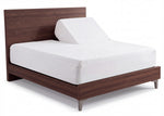 Tencel Dream white split head mattress protector fitted on an adjustable bed, with one side of the mattress raised to show independent head positioning