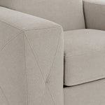Valetta Sofa - Ivory close-up showing textured upholstery and decorative cross stitching on the wide track arm