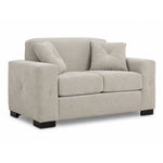 Valetta Loveseat - Ivory angled view with two seat cushions, wide track arms, dark block feet and two matching accent pillows