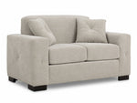 Valetta Loveseat - Ivory angled view with two seat cushions, wide track arms, dark block feet and two accent pillows