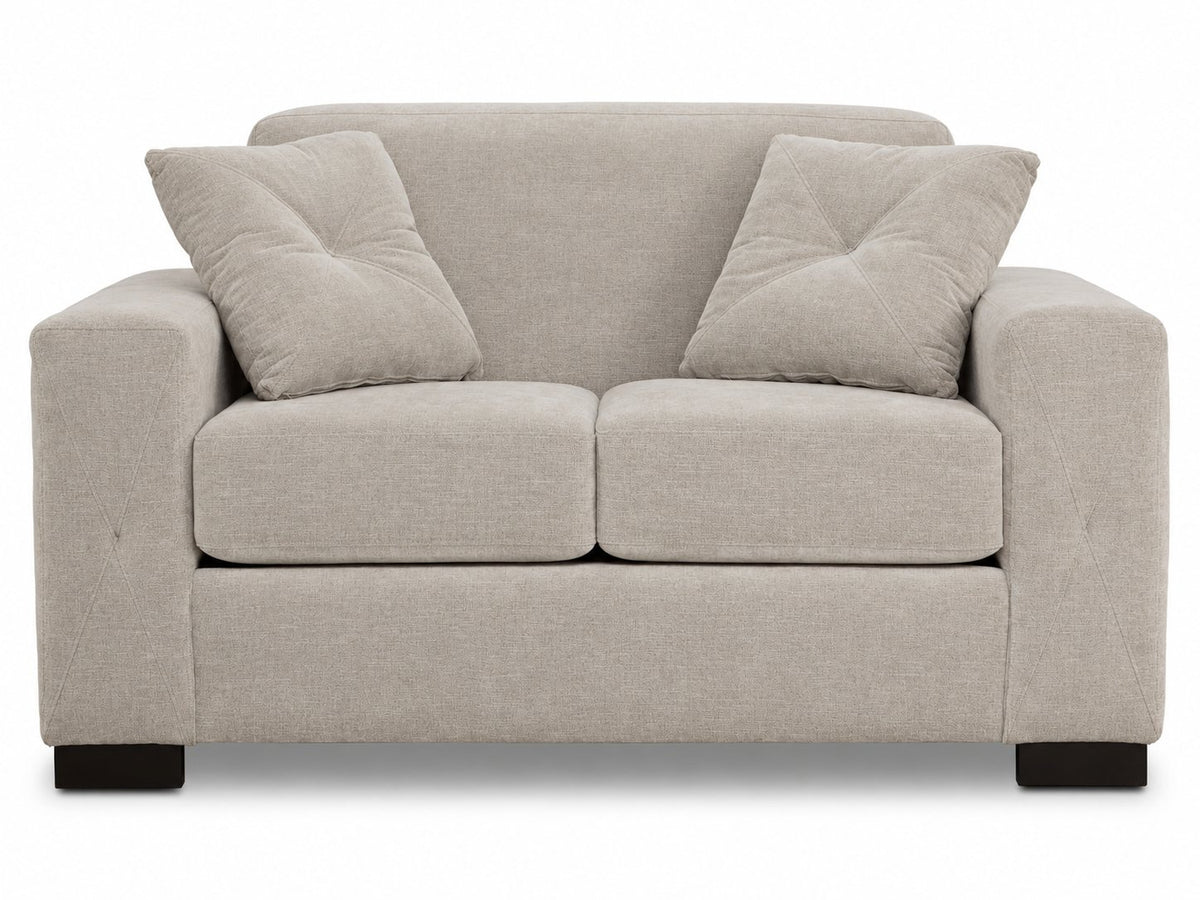 Valetta Loveseat - Ivory front view with two seat cushions, wide track arms, dark block feet and matching accent pillows