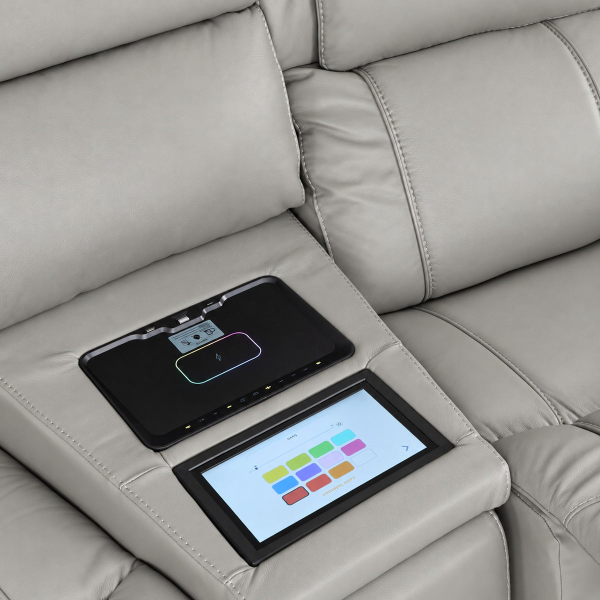 Velocity light grey console close-up showing touchscreen colour controls and illuminated wireless charging pad