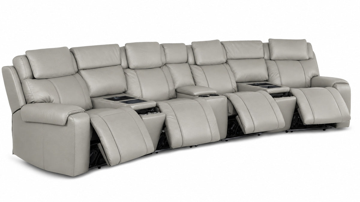 Velocity light grey leather home theatre seating angled view with four power footrests extended and three consoles