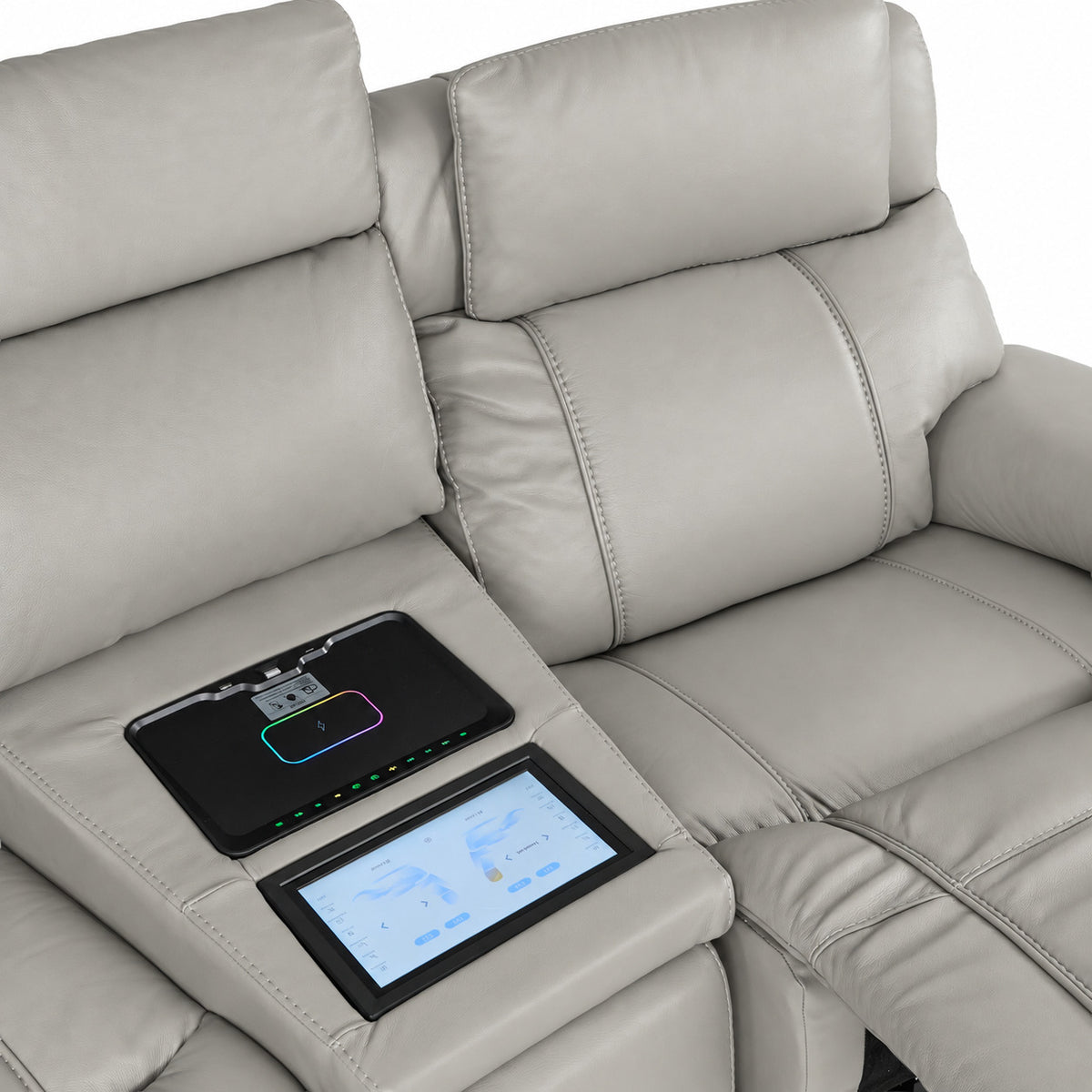 Velocity light grey seating close-up showing padded headrest, touchscreen console and wireless charging pad